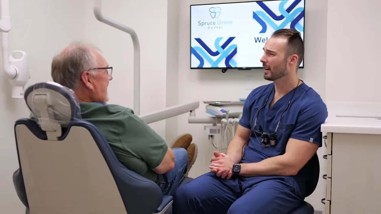 Dr. Jonathan Adler reviewing treatment with a patient chairside