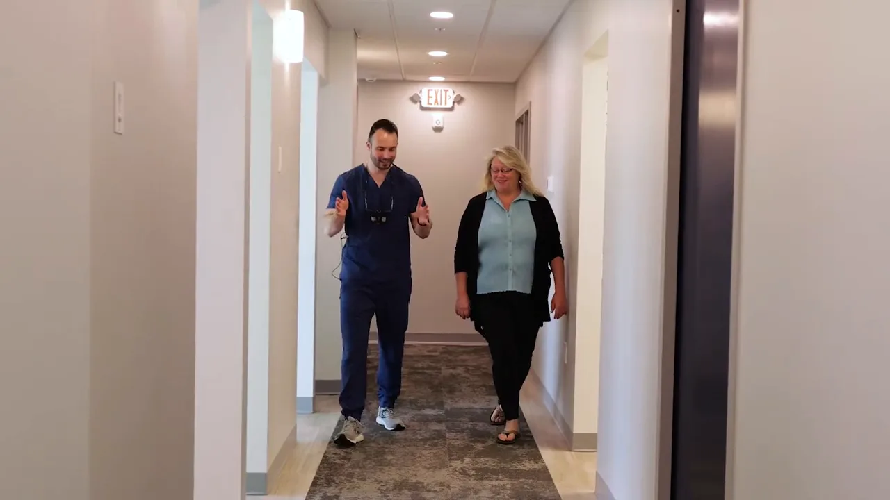 Dr. Jonathan Adler reviewing digital X-rays with a patient